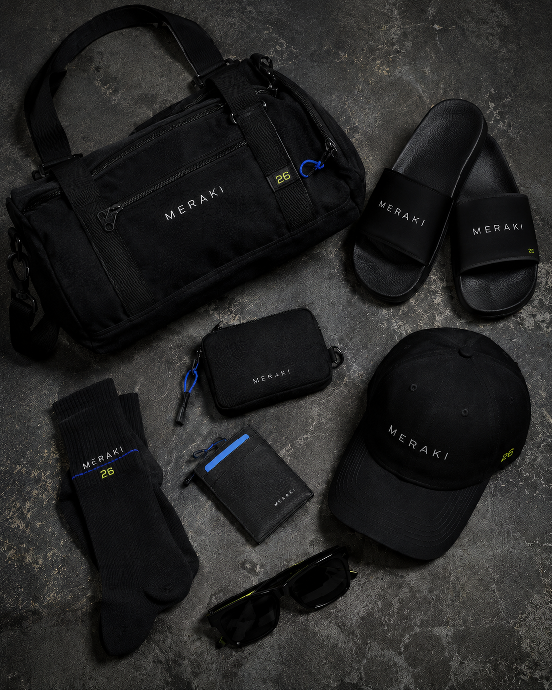 Meraki accessories including a bag, slides, cap, pouch, socks, wallet, and sunglasses