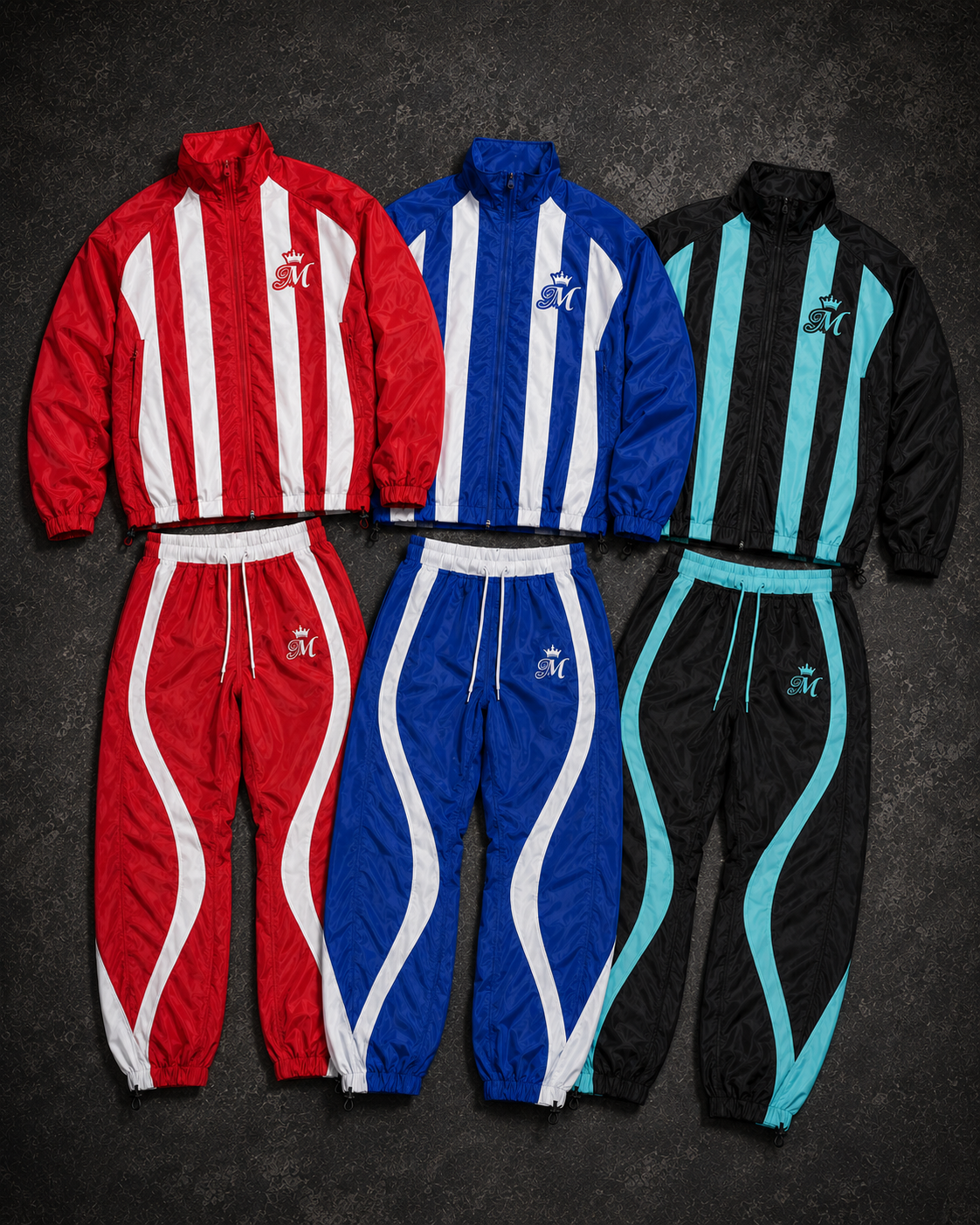 Red, royal blue, and Black Tiffany Blue Crown M Meraki tracksuits on a premium dark textured background